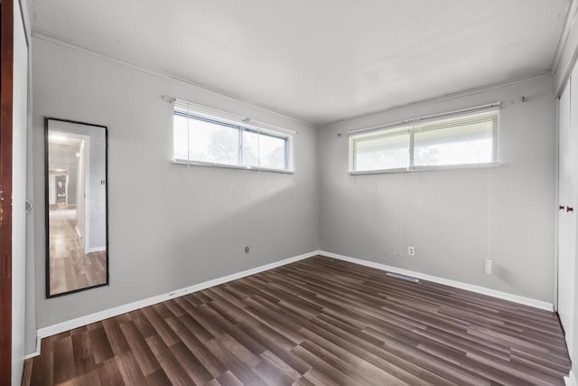 3505 Roswell Dr, Columbus, OH 43227 - empty room with plenty of natural light, dark wood finished floors, and crown molding