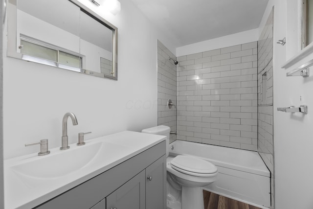 3505 Roswell Dr, Columbus, OH 43227 - full bath featuring vanity, tub / shower combination, and wood finished floors