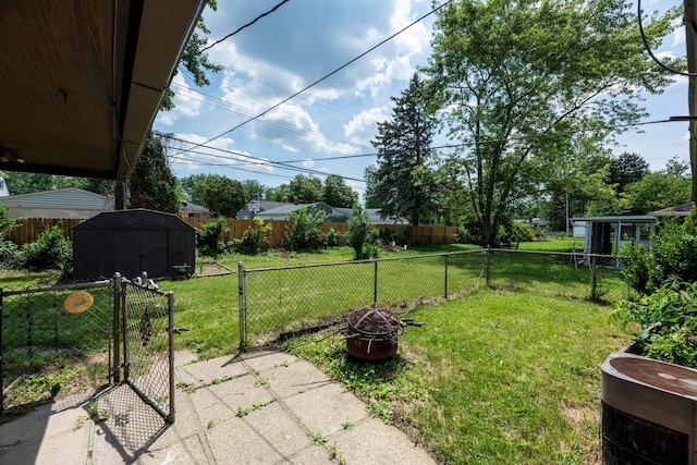 3505 Roswell Dr, Columbus, OH 43227 - fenced backyard with a storage shed and an outdoor fire pit