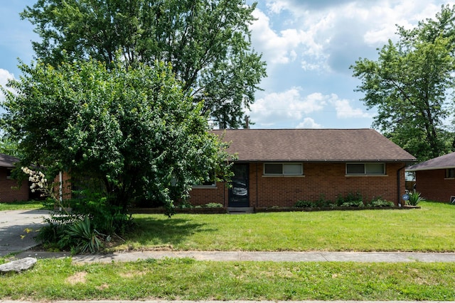3505 Roswell Dr, Columbus, OH 43227 - view of front of property featuring brick siding, a front lawn, and a shingled roof