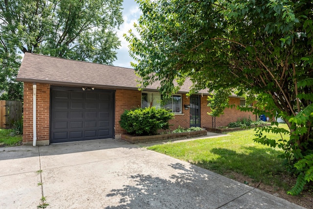 3505 Roswell Dr, Columbus, OH 43227 - view of front of house featuring a garage, brick siding, driveway, and roof with shingles