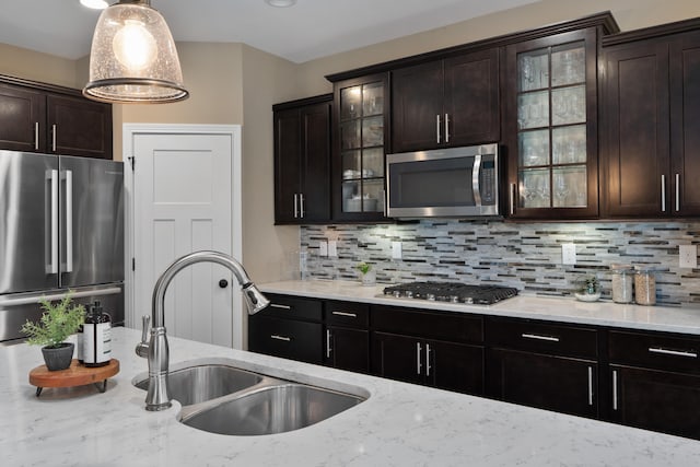 6196 Streamside Dr, Galena, OH 43021 - kitchen with appliances with stainless steel finishes, backsplash, and light stone counters
