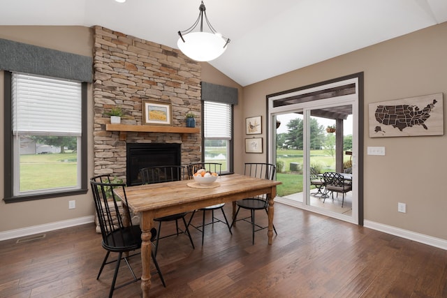6196 Streamside Dr, Galena, OH 43021 - dining area featuring dark wood-type flooring, a fireplace, and high vaulted ceiling