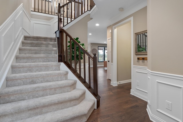 6196 Streamside Dr, Galena, OH 43021 - stairs with wood finished floors, a decorative wall, recessed lighting, and a wainscoted wall
