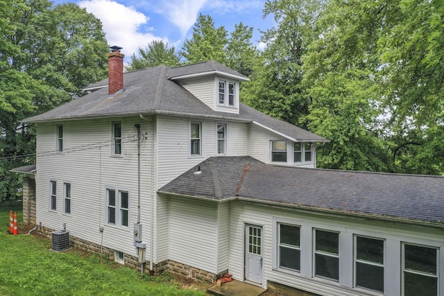 6135 Westfall Rd SW, Lancaster, OH 43130 - view of side of home featuring a chimney, roof with shingles, and a lawn