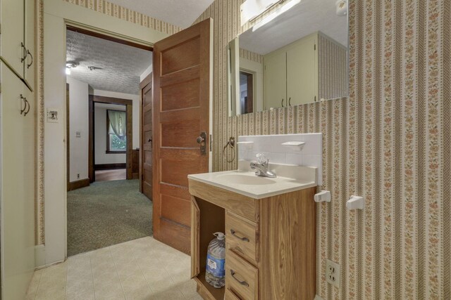 6135 Westfall Rd SW, Lancaster, OH 43130 - bathroom with vanity, a textured ceiling, tile patterned floors, and curtained shower