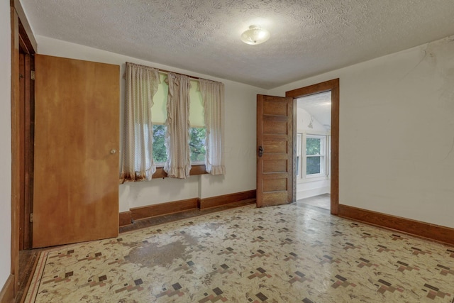 6135 Westfall Rd SW, Lancaster, OH 43130 - spare room with baseboards and a textured ceiling