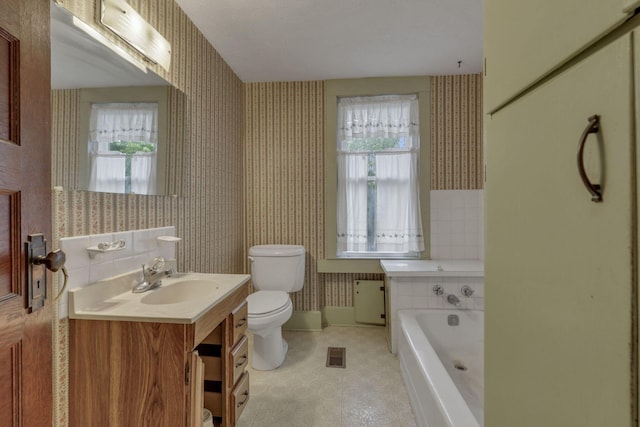 6135 Westfall Rd SW, Lancaster, OH 43130 - bathroom with wallpapered walls, healthy amount of natural light, a bath, vanity, and radiator