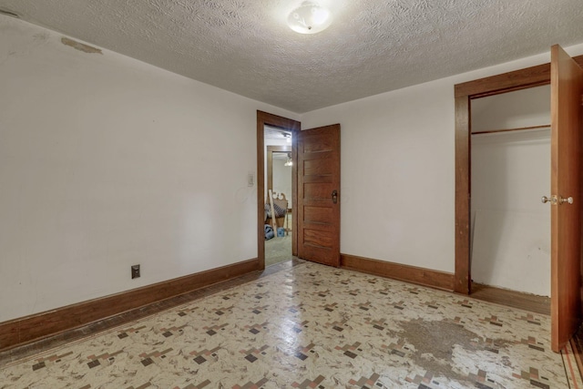 6135 Westfall Rd SW, Lancaster, OH 43130 - unfurnished bedroom with a textured ceiling and a closet