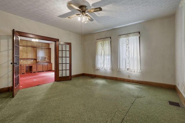 6135 Westfall Rd SW, Lancaster, OH 43130 - empty room featuring french doors, a ceiling fan, and a textured ceiling