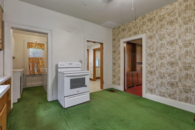 6135 Westfall Rd SW, Lancaster, OH 43130 - kitchen with electric stove, wallpapered walls, carpet, and light countertops