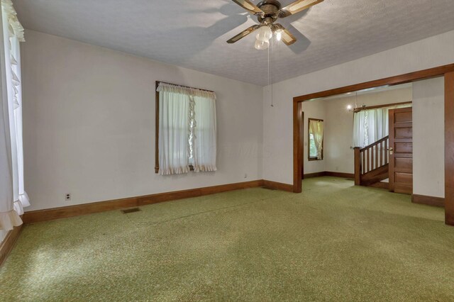 6135 Westfall Rd SW, Lancaster, OH 43130 - carpeted empty room with healthy amount of natural light, ceiling fan, and a chandelier
