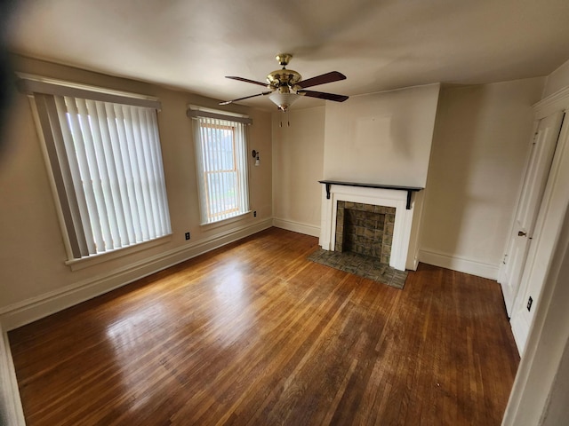 1058 Fair Ave, Columbus, OH 43205 - unfurnished living room featuring a fireplace, wood finished floors, and a ceiling fan