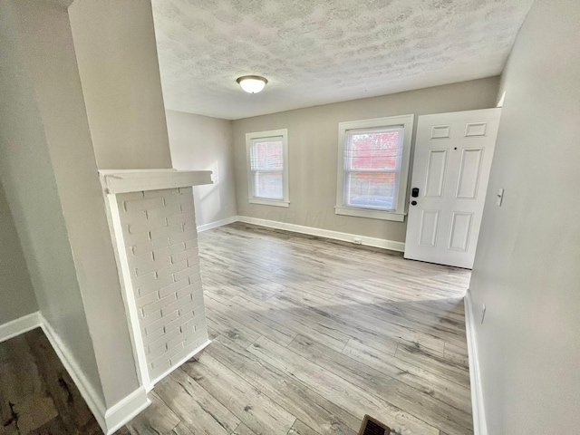 1116-1122 Cole St, Columbus, OH 43205 - foyer featuring a textured ceiling and wood finished floors