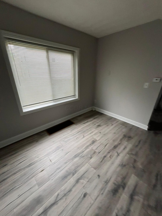 1116-1122 Cole St, Columbus, OH 43205 - empty room with wood finished floors and baseboards