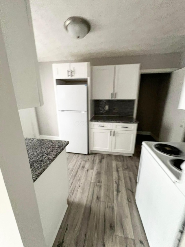 1116-1122 Cole St, Columbus, OH 43205 - kitchen with white appliances, white cabinetry, a textured ceiling, light wood-type flooring, and backsplash