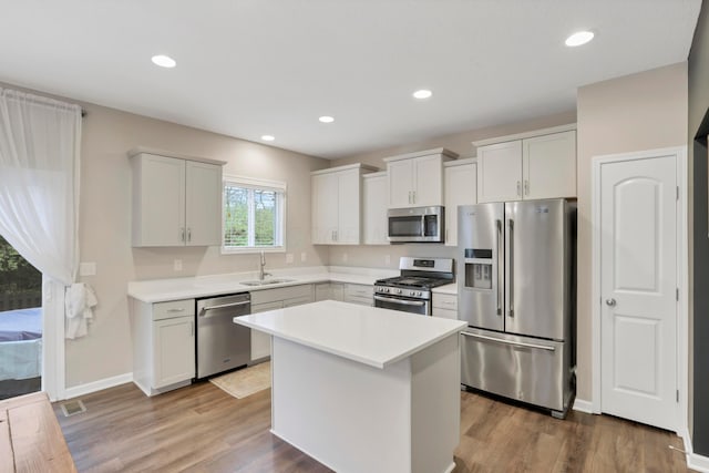 3987 Mad River Rd, Grove City, OH 43123 - kitchen with stainless steel appliances, light countertops, wood finished floors, and recessed lighting