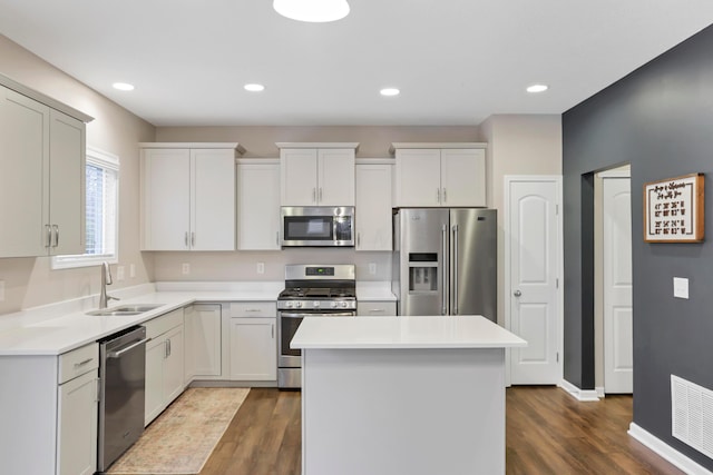 3987 Mad River Rd, Grove City, OH 43123 - kitchen featuring appliances with stainless steel finishes, a center island, dark wood-style floors, light countertops, and recessed lighting