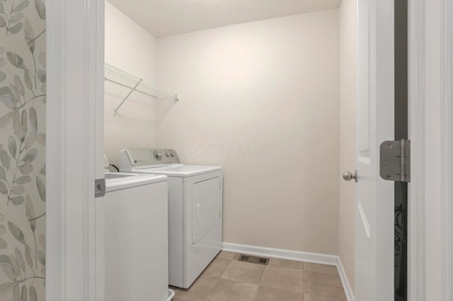 3987 Mad River Rd, Grove City, OH 43123 - laundry area with washer and dryer and light tile patterned floors