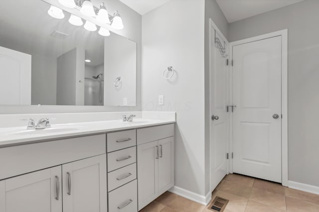 3987 Mad River Rd, Grove City, OH 43123 - full bathroom with double vanity and tile patterned floors