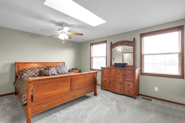 2110 Pickerington Rd, Carroll, OH 43112 - bedroom featuring a skylight, light colored carpet, and a ceiling fan