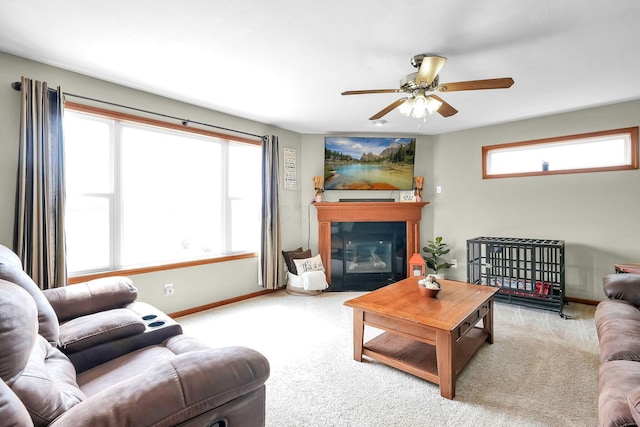 2110 Pickerington Rd, Carroll, OH 43112 - carpeted living room featuring ceiling fan and a fireplace with flush hearth