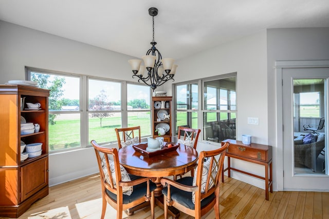 8150 Concord Rd, Delaware, OH 43015 - dining space with light wood-style flooring and a chandelier