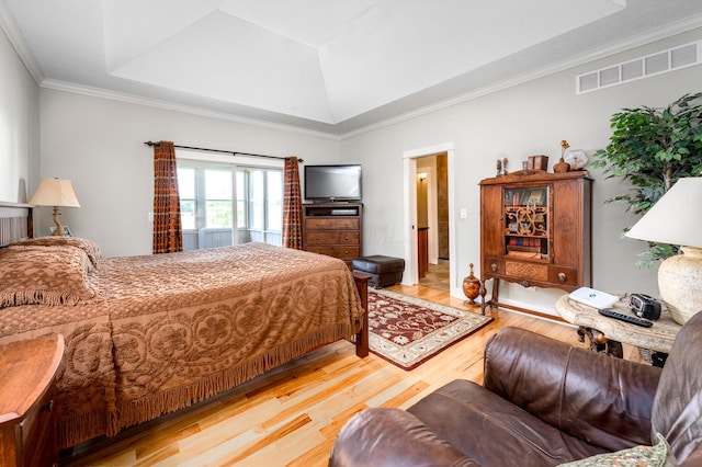 8150 Concord Rd, Delaware, OH 43015 - bedroom featuring wood finished floors, a tray ceiling, and crown molding