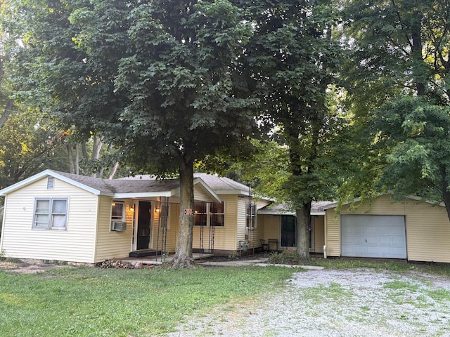 407 Marion St Unit 403, Mcguffey, OH 45859 - view of front facade featuring a front yard, driveway, and covered porch