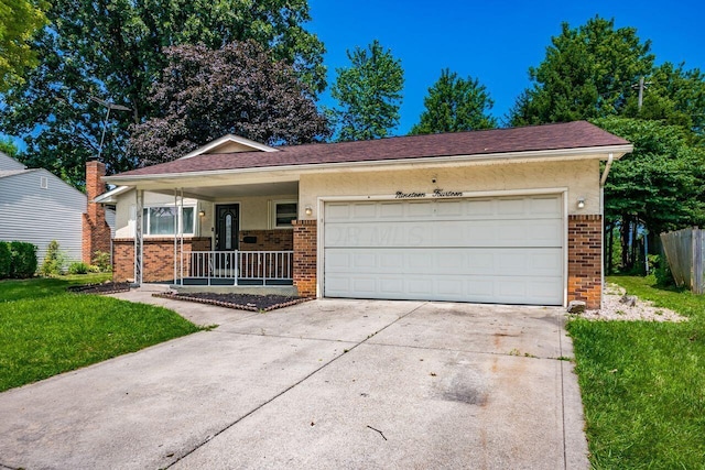1914 Walden Dr, Columbus, OH 43229 - single story home with brick siding, driveway, a porch, a garage, and stucco siding