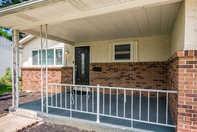 1914 Walden Dr, Columbus, OH 43229 - doorway to property featuring brick siding and stucco siding