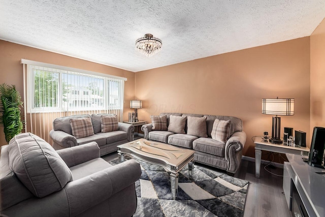 1914 Walden Dr, Columbus, OH 43229 - living room with wood finished floors, a chandelier, and a textured ceiling