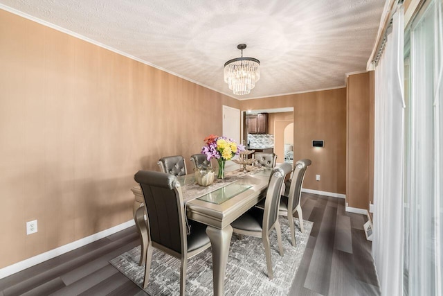 1914 Walden Dr, Columbus, OH 43229 - dining area with dark wood-style floors, a chandelier, and ornamental molding