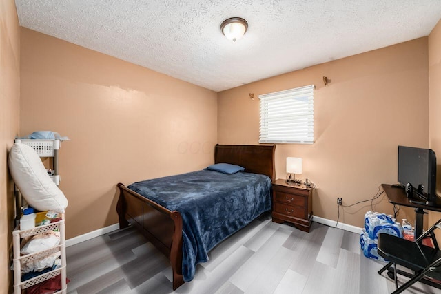 1914 Walden Dr, Columbus, OH 43229 - bedroom featuring wood finished floors and a textured ceiling