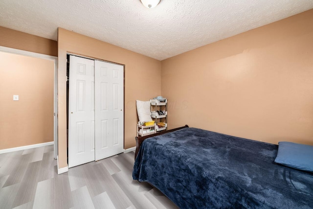 1914 Walden Dr, Columbus, OH 43229 - bedroom featuring wood finished floors, a closet, and a textured ceiling