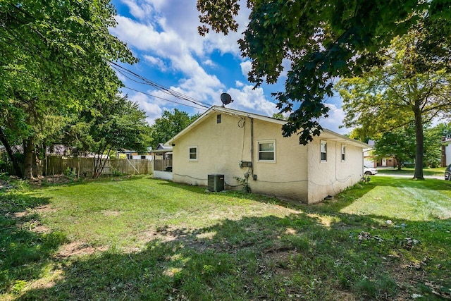 1914 Walden Dr, Columbus, OH 43229 - view of side of home with stucco siding and a cooling unit