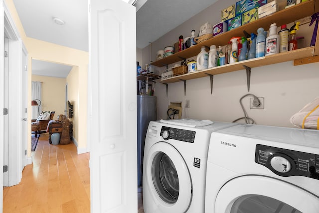 579 Buckeye Ln, Mount Gilead, OH 43338 - laundry room featuring washing machine and clothes dryer and light wood-style floors