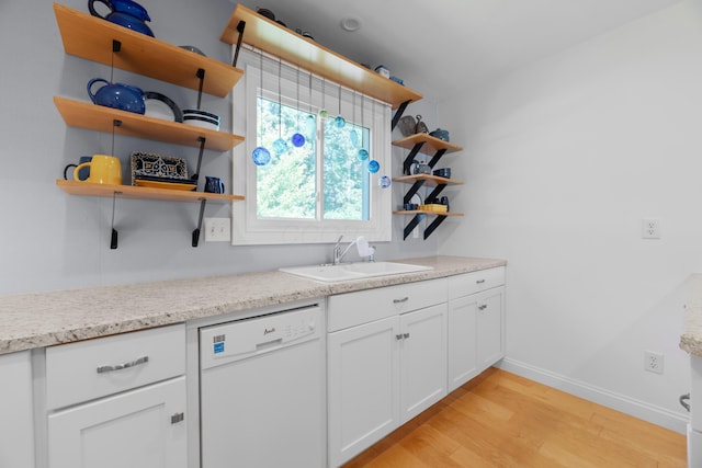579 Buckeye Ln, Mount Gilead, OH 43338 - kitchen featuring white dishwasher, open shelves, light wood-style flooring, and white cabinetry