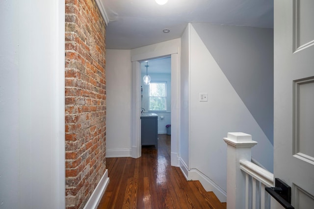 619 Columbus Ave, Washington Court House, OH 43160 - hallway with an upstairs landing, hardwood / wood-style floors, and brick wall