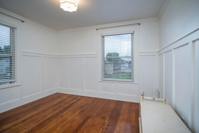 619 Columbus Ave, Washington Court House, OH 43160 - empty room with a decorative wall, dark wood-style floors, wainscoting, and ornamental molding
