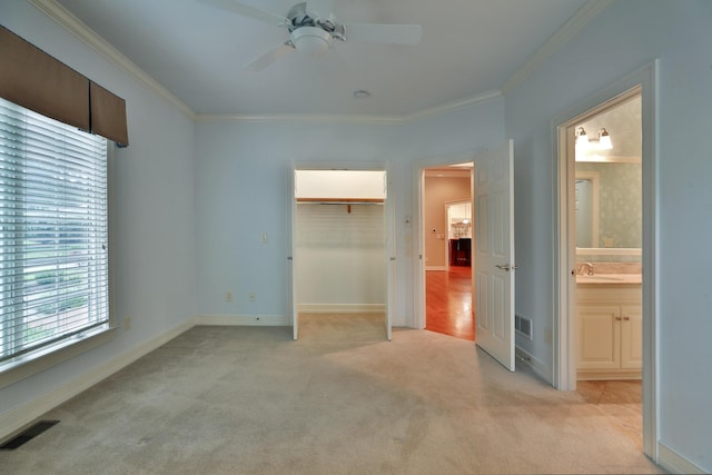 580 Keyes Ln, Worthington, OH 43085 - unfurnished bedroom with light carpet, crown molding, a closet, a ceiling fan, and ensuite bath