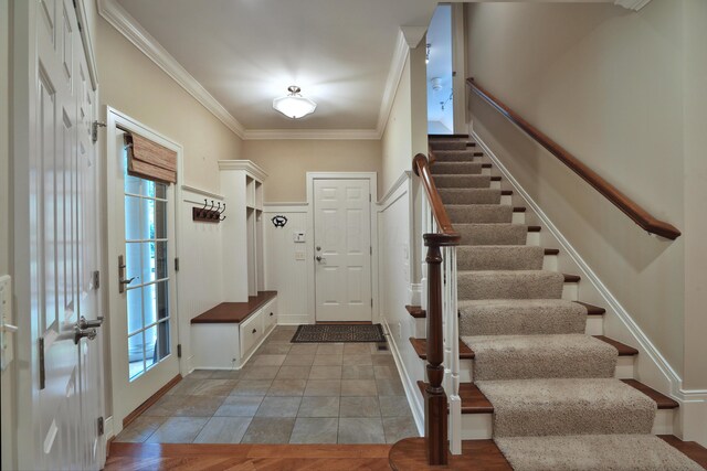 580 Keyes Ln, Worthington, OH 43085 - mudroom featuring crown molding and plenty of natural light