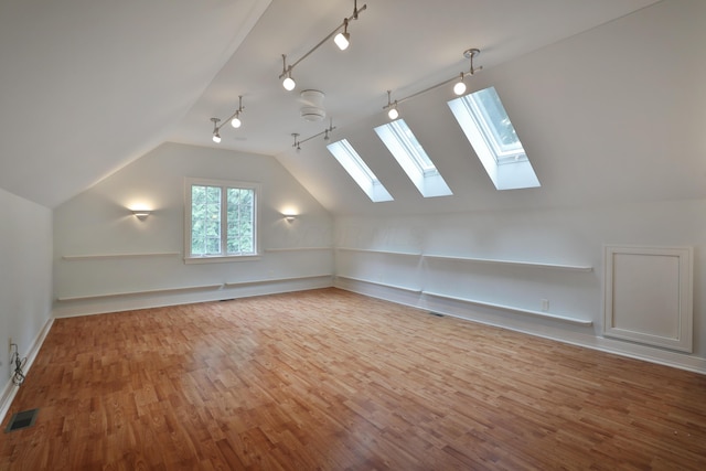 580 Keyes Ln, Worthington, OH 43085 - bonus room with a skylight, wood finished floors, and lofted ceiling