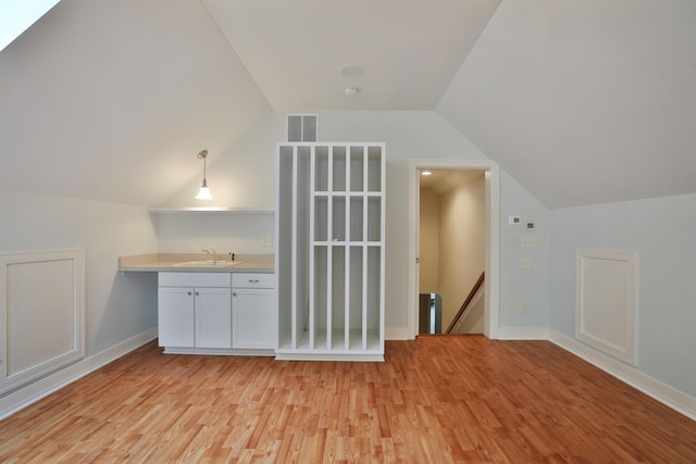 580 Keyes Ln, Worthington, OH 43085 - additional living space featuring vaulted ceiling and light wood-style flooring