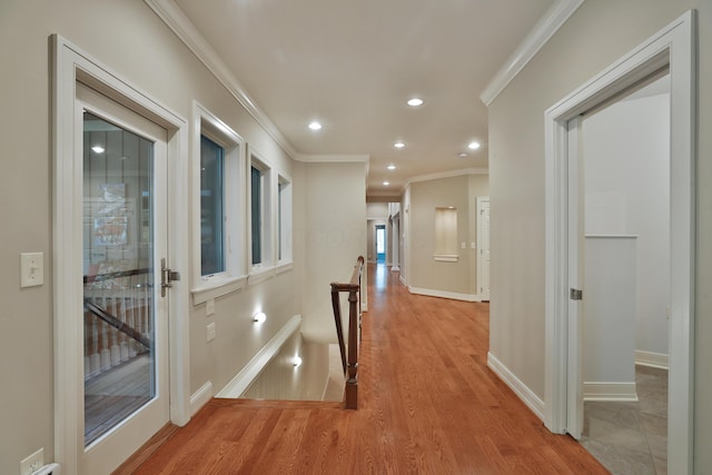 580 Keyes Ln, Worthington, OH 43085 - hallway featuring ornamental molding, recessed lighting, light wood-style flooring, and an upstairs landing