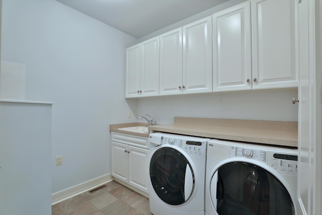580 Keyes Ln, Worthington, OH 43085 - laundry area with independent washer and dryer and cabinet space