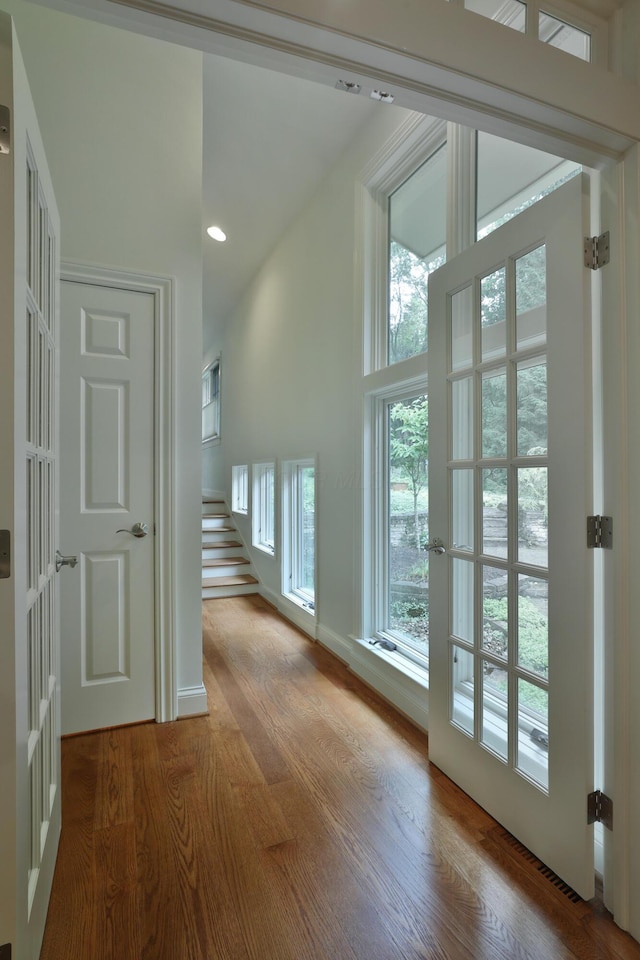 580 Keyes Ln, Worthington, OH 43085 - hall with wood finished floors, stairs, and recessed lighting
