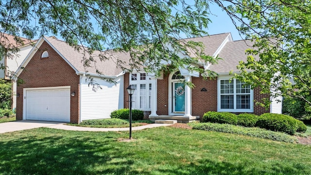 180 Locust Curve Dr, Delaware, OH 43015 - view of front facade with brick siding, driveway, a garage, and a front yard