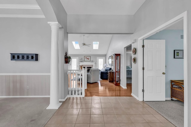 180 Locust Curve Dr, Delaware, OH 43015 - foyer with decorative columns, tile patterned floors, a skylight, and vaulted ceiling