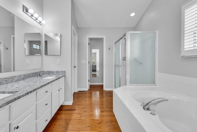 180 Locust Curve Dr, Delaware, OH 43015 - bathroom featuring double vanity, a bath, a shower stall, and plenty of natural light